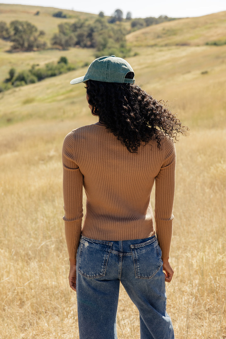 a woman standing in a field