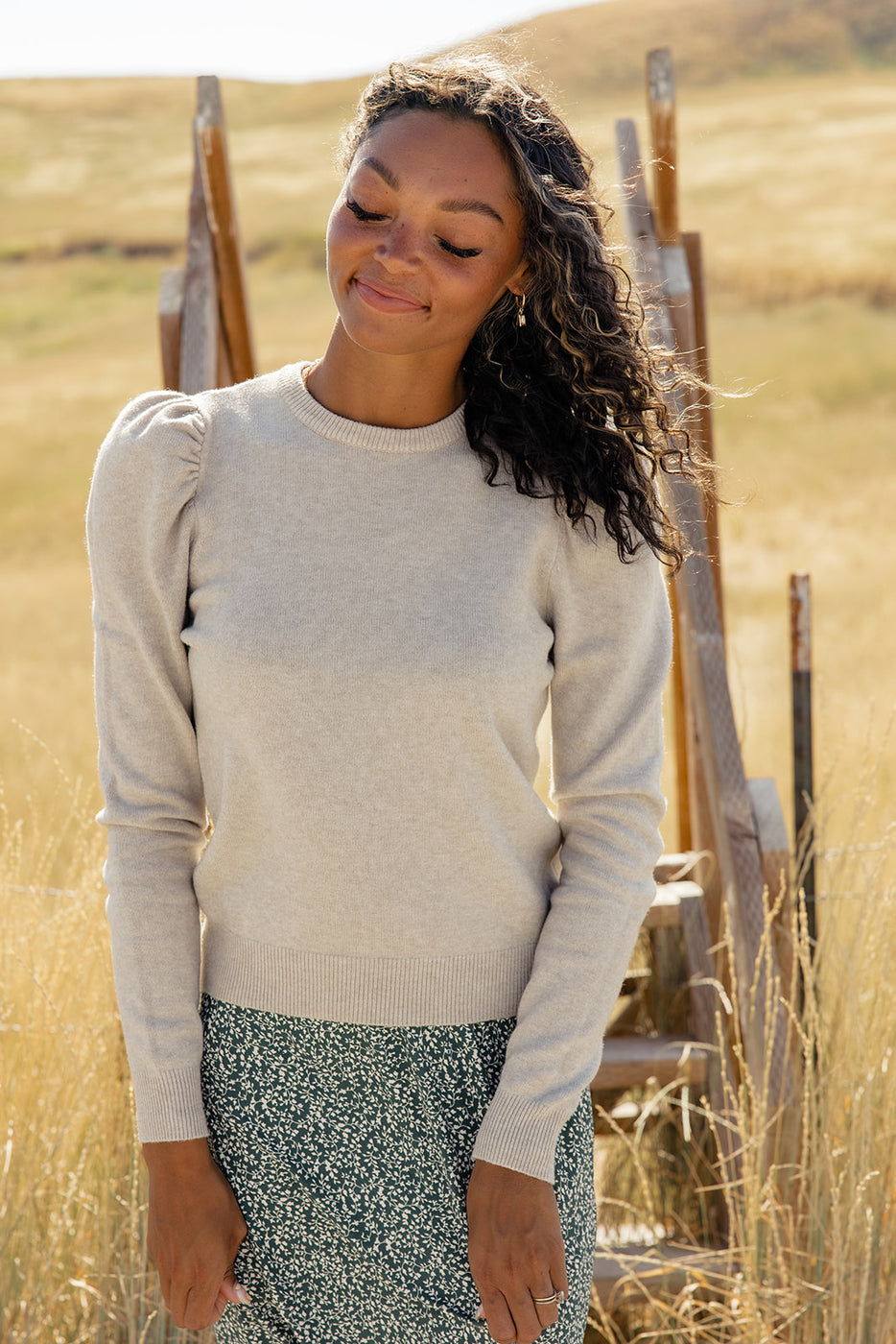 a woman standing in a field