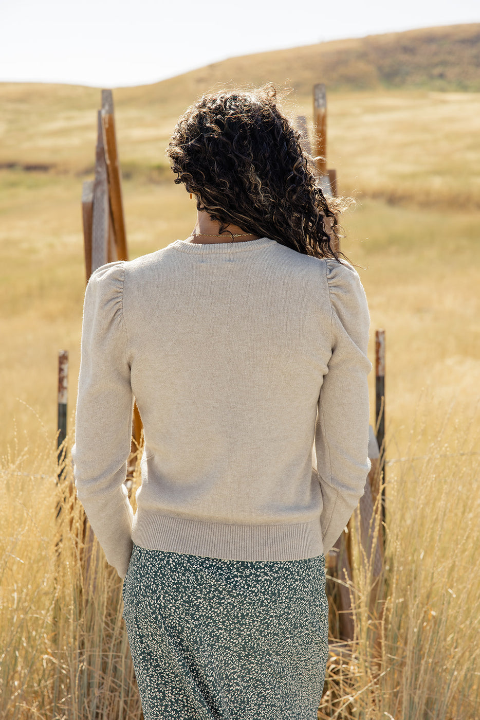 a woman standing in a field