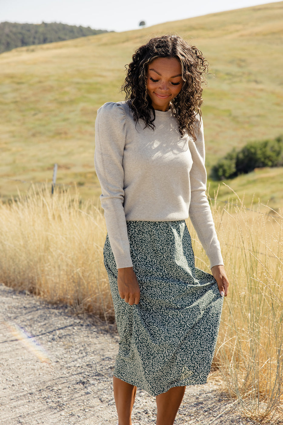 a woman standing on a road