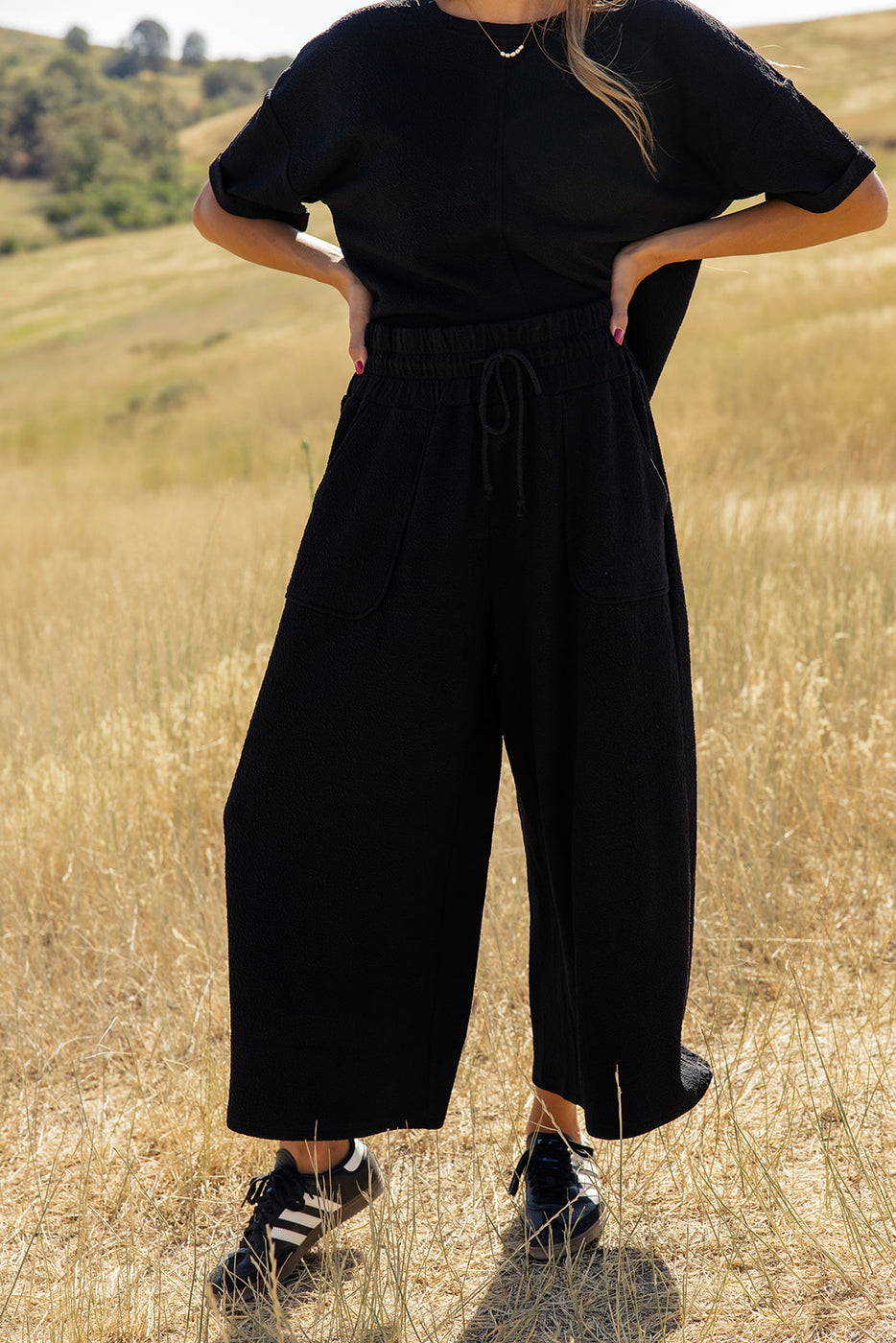 a woman in black pants