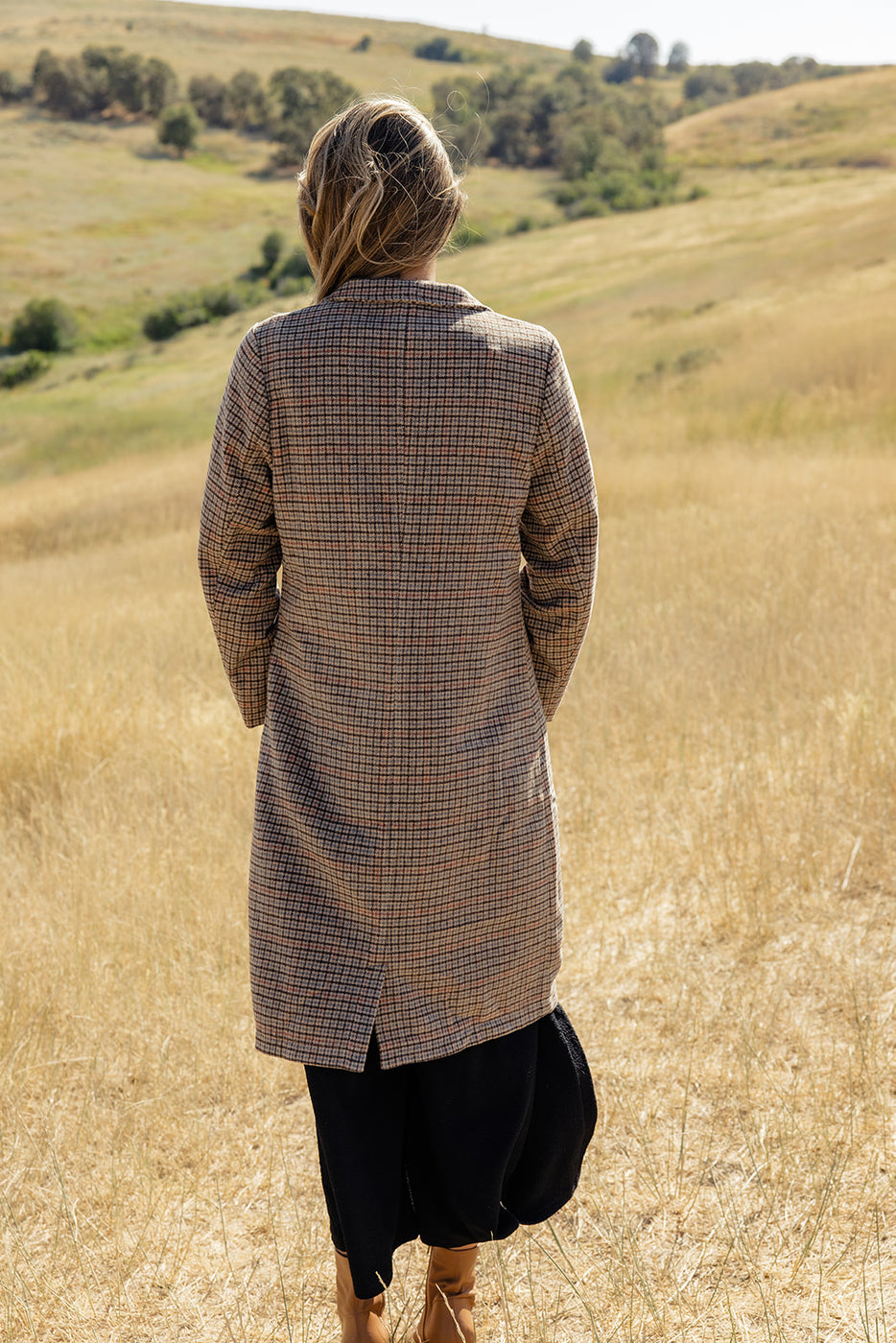 a woman standing in a field