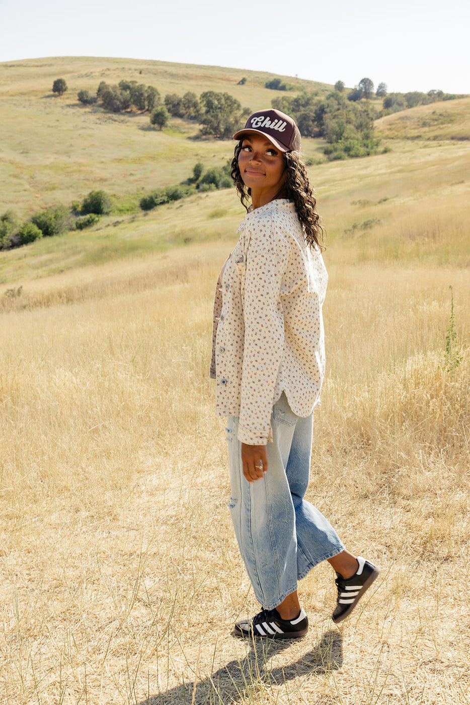 a woman standing in a field