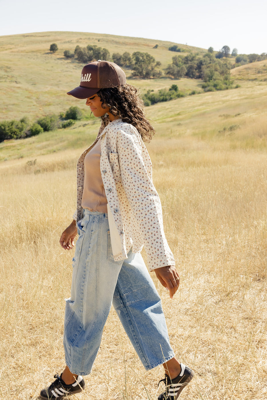 a woman walking in a field