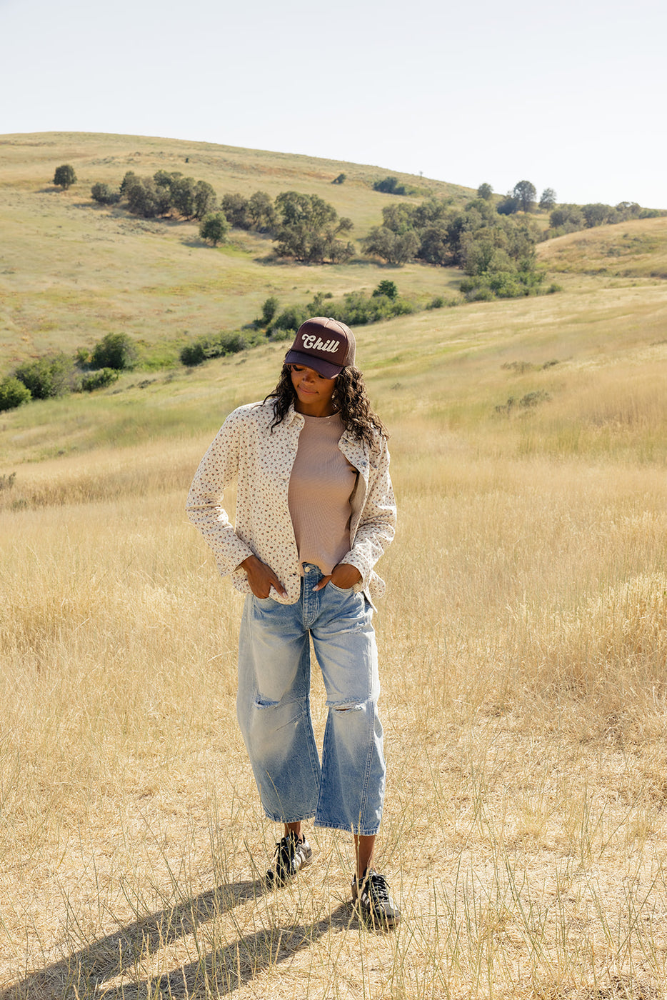 a woman standing in a field