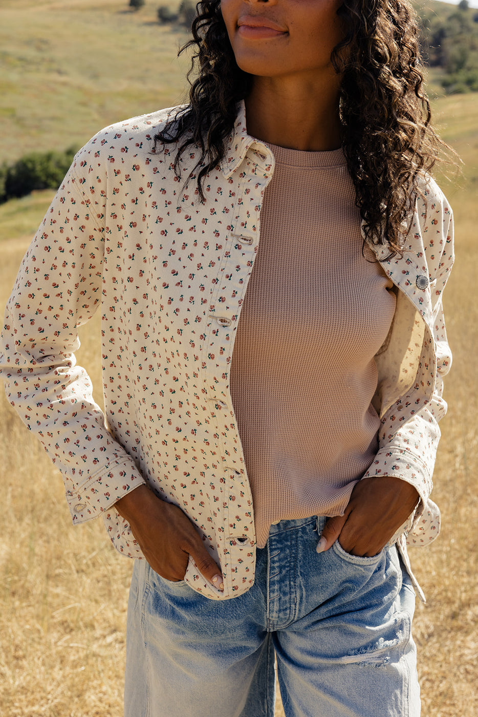 a woman standing in a field