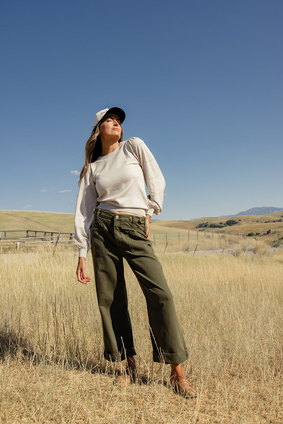 a woman standing in a field