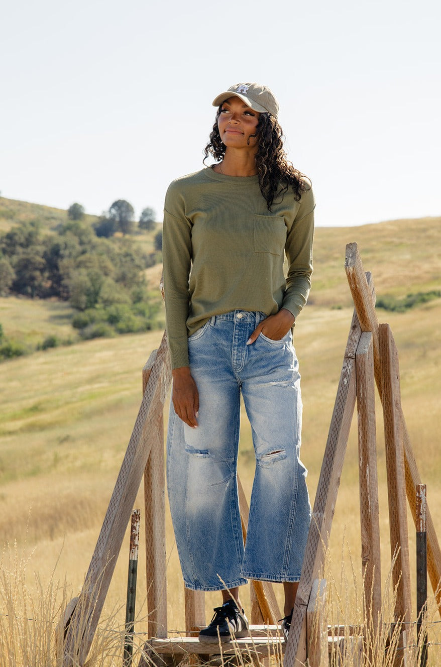 a woman standing in a field