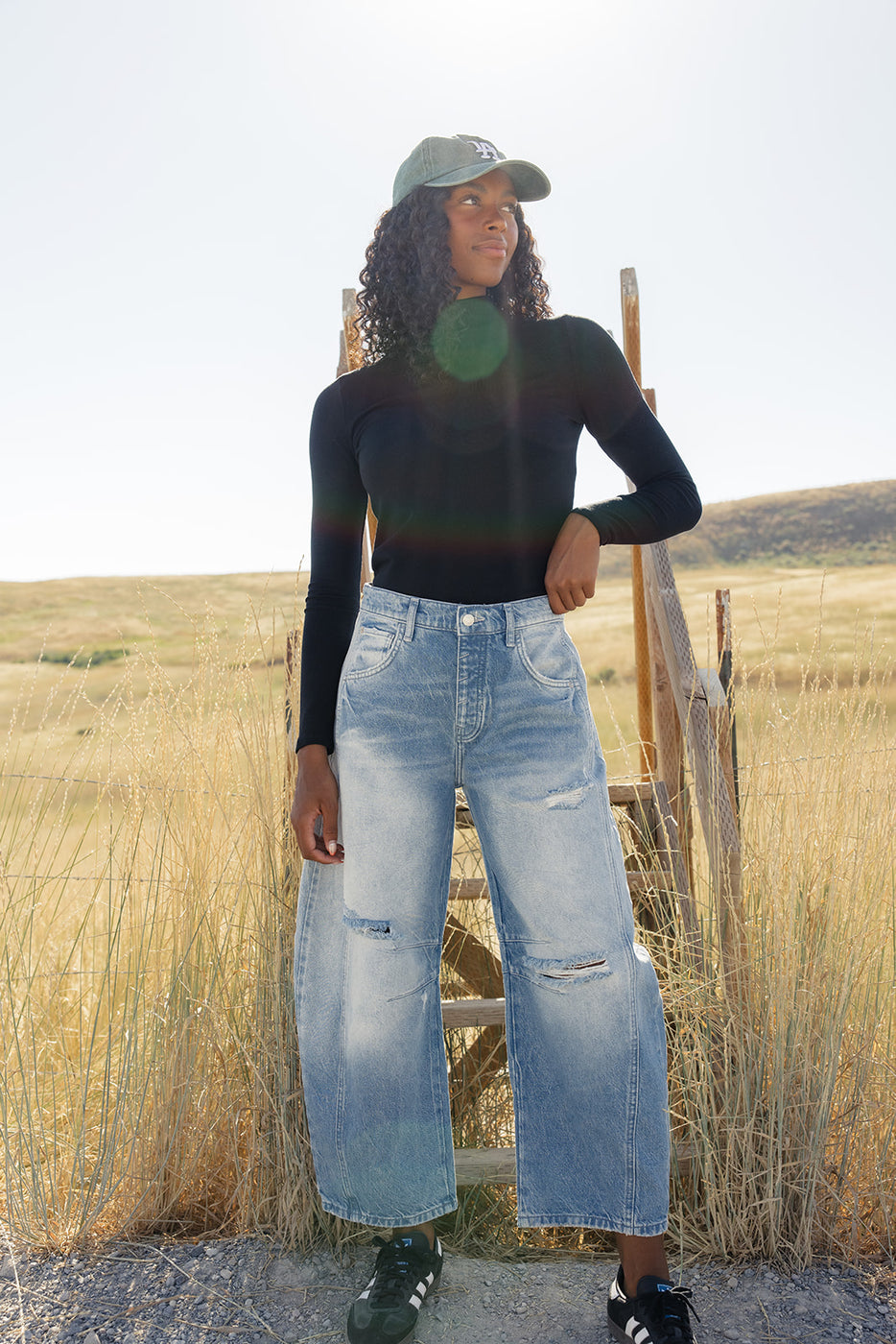 a woman standing in a field