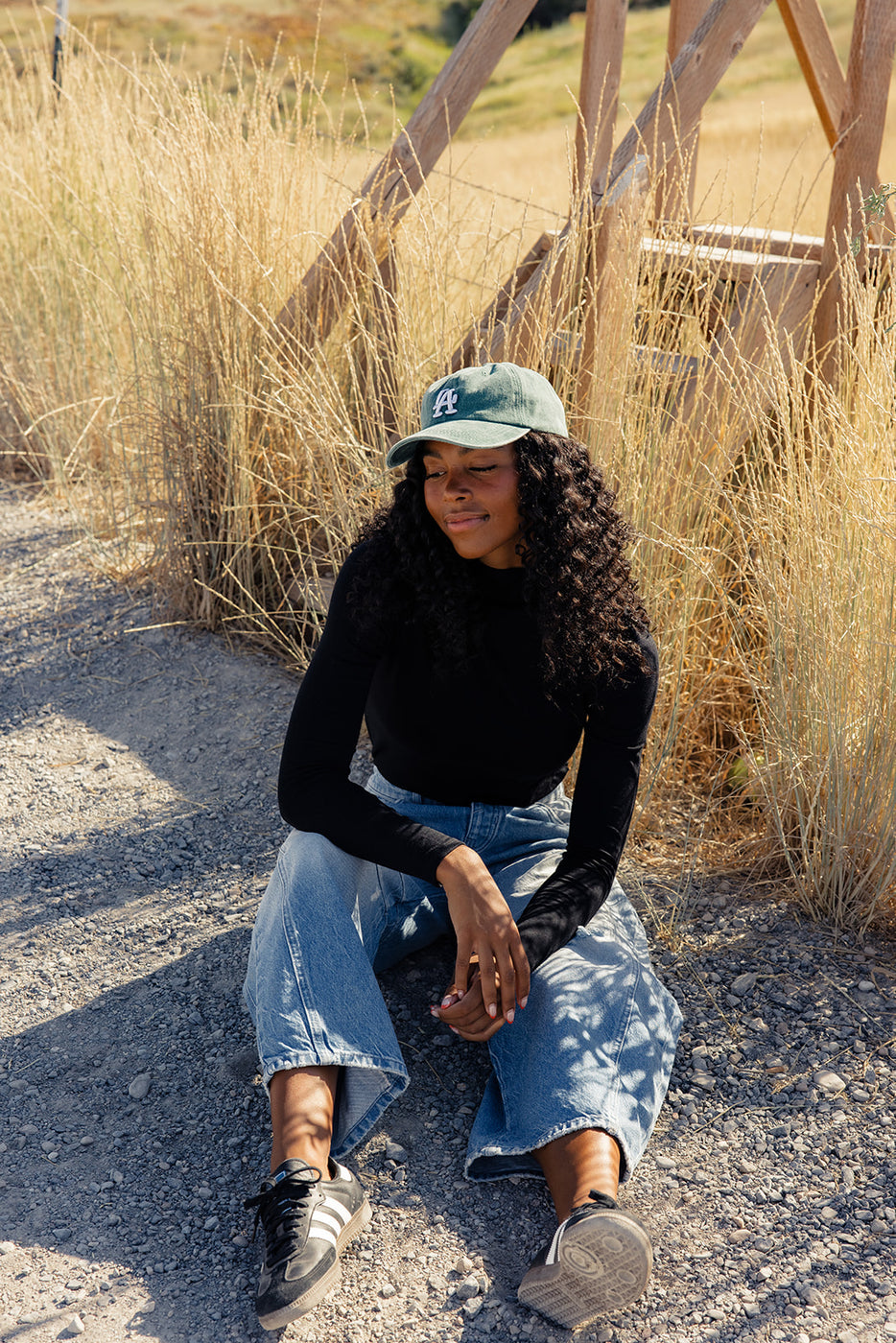 a woman sitting on the ground