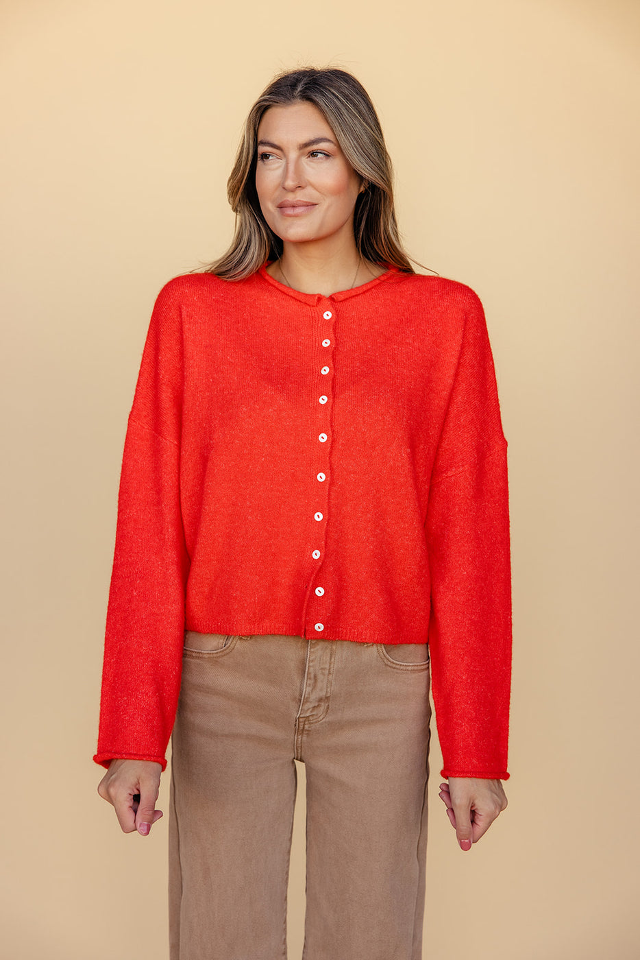 a woman in a red sweater