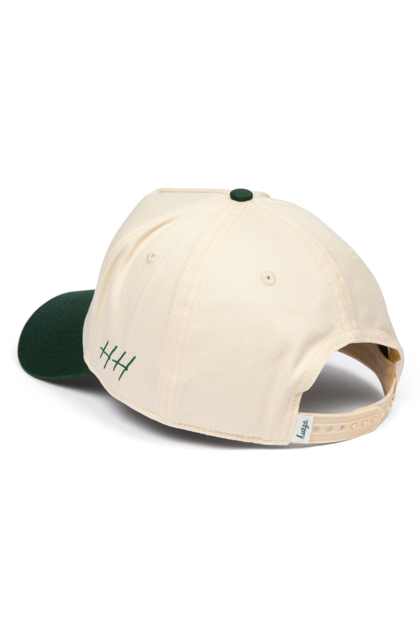 a white and green baseball cap