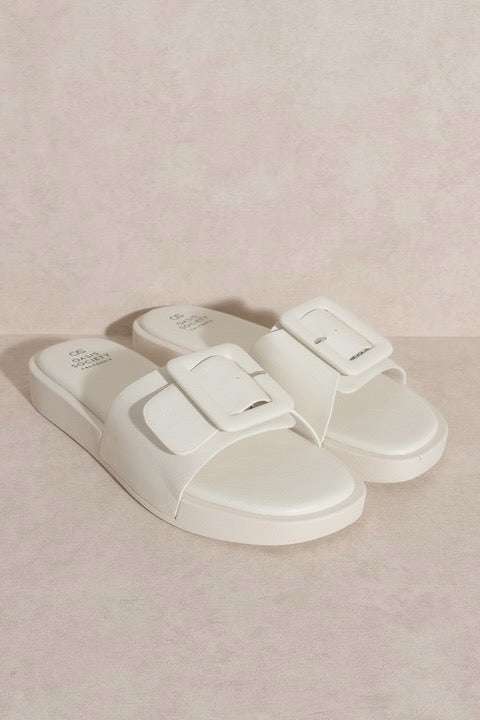 a pair of white sandals