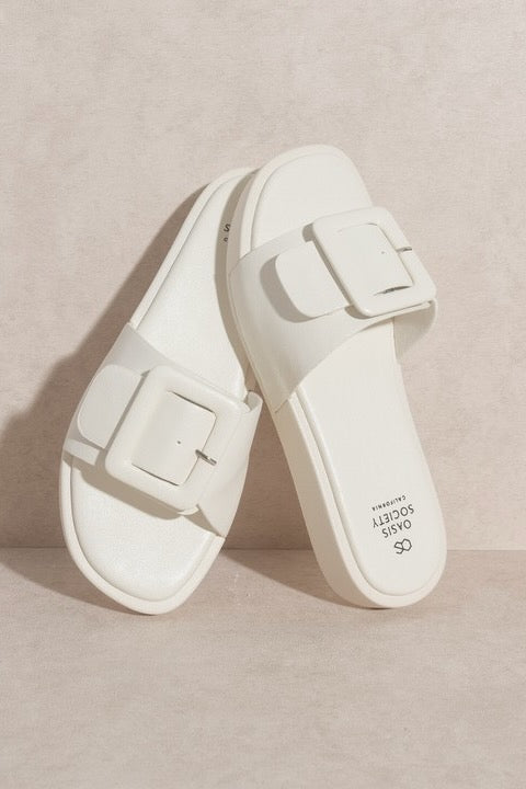 a pair of white sandals
