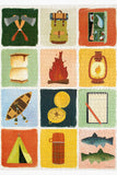 Patchwork design with camping-themed illustrations in a grid pattern.
