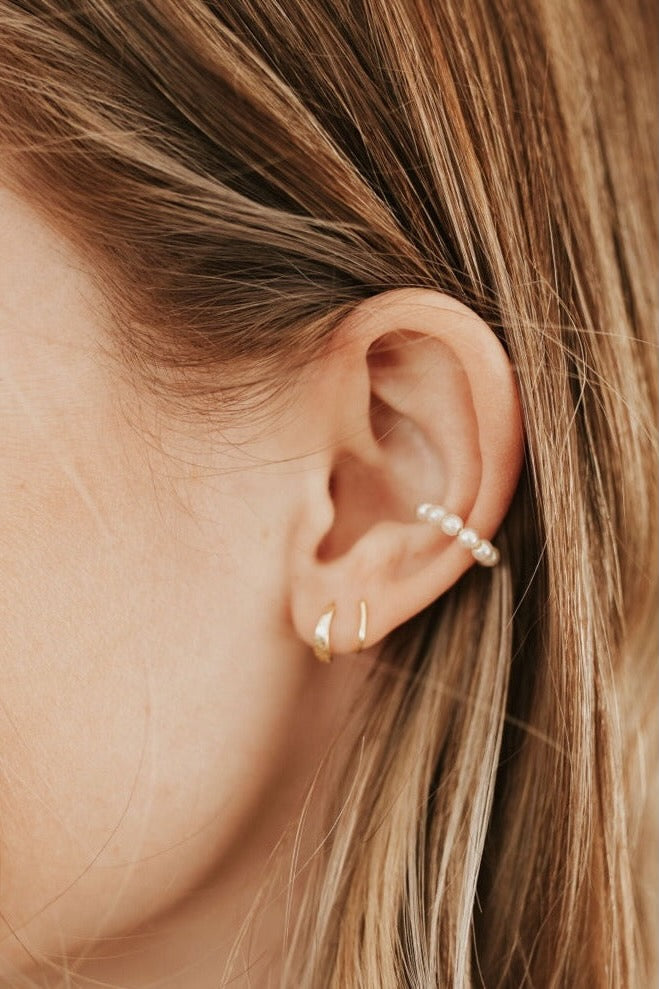 a close up of a woman's ear