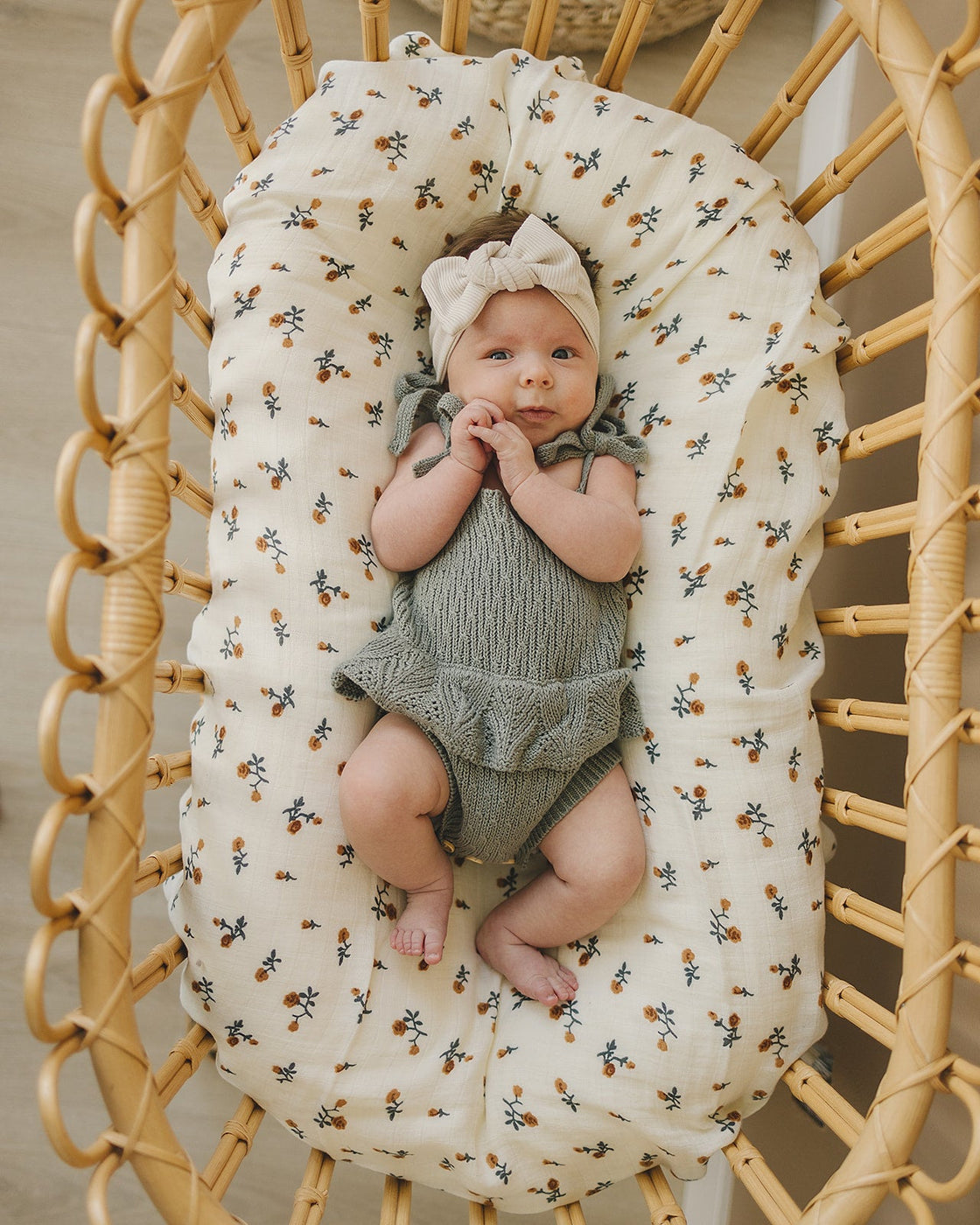 a baby lying in a crib