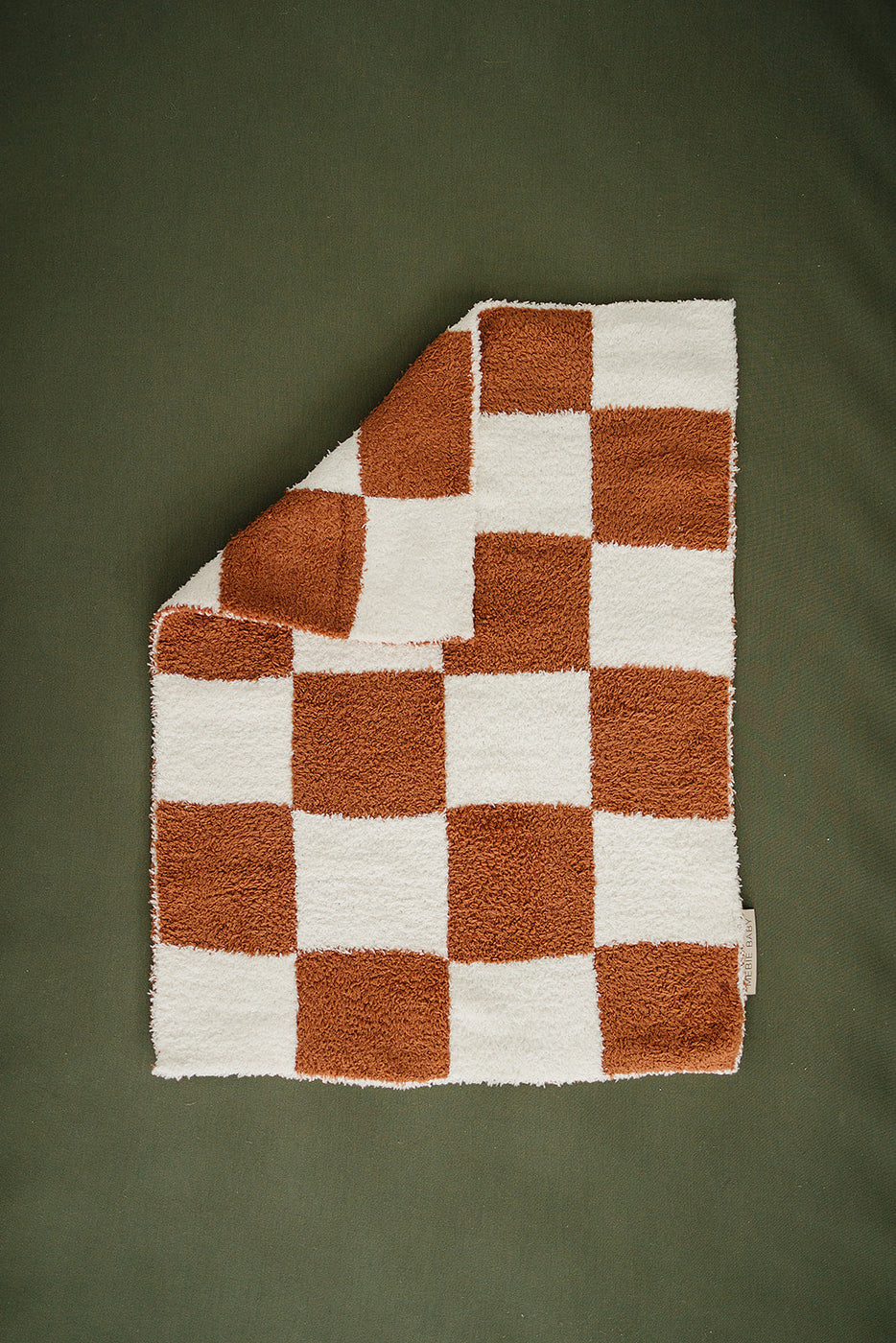 a blanket on a green surface