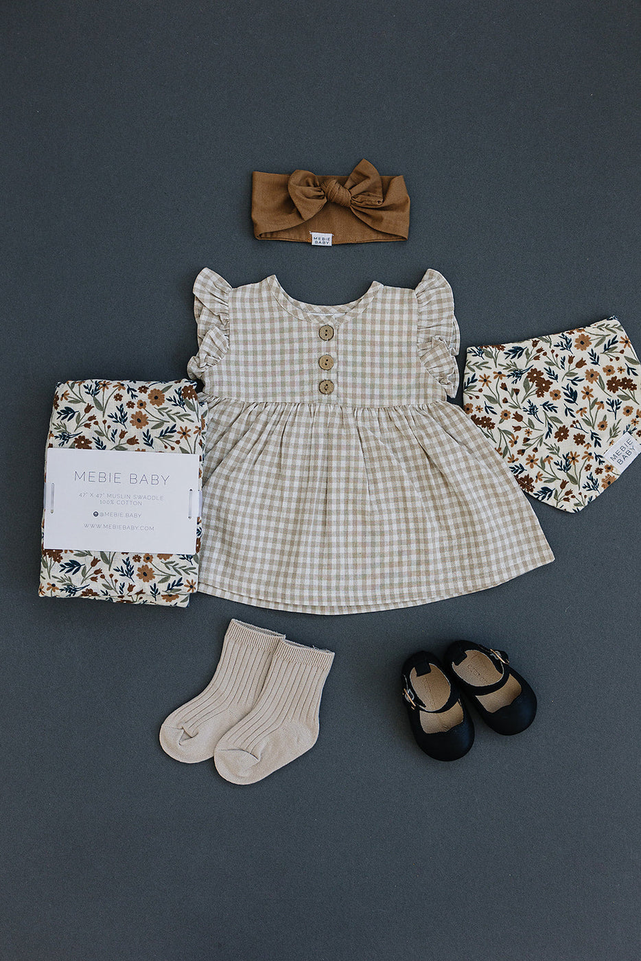 a baby clothes and shoes