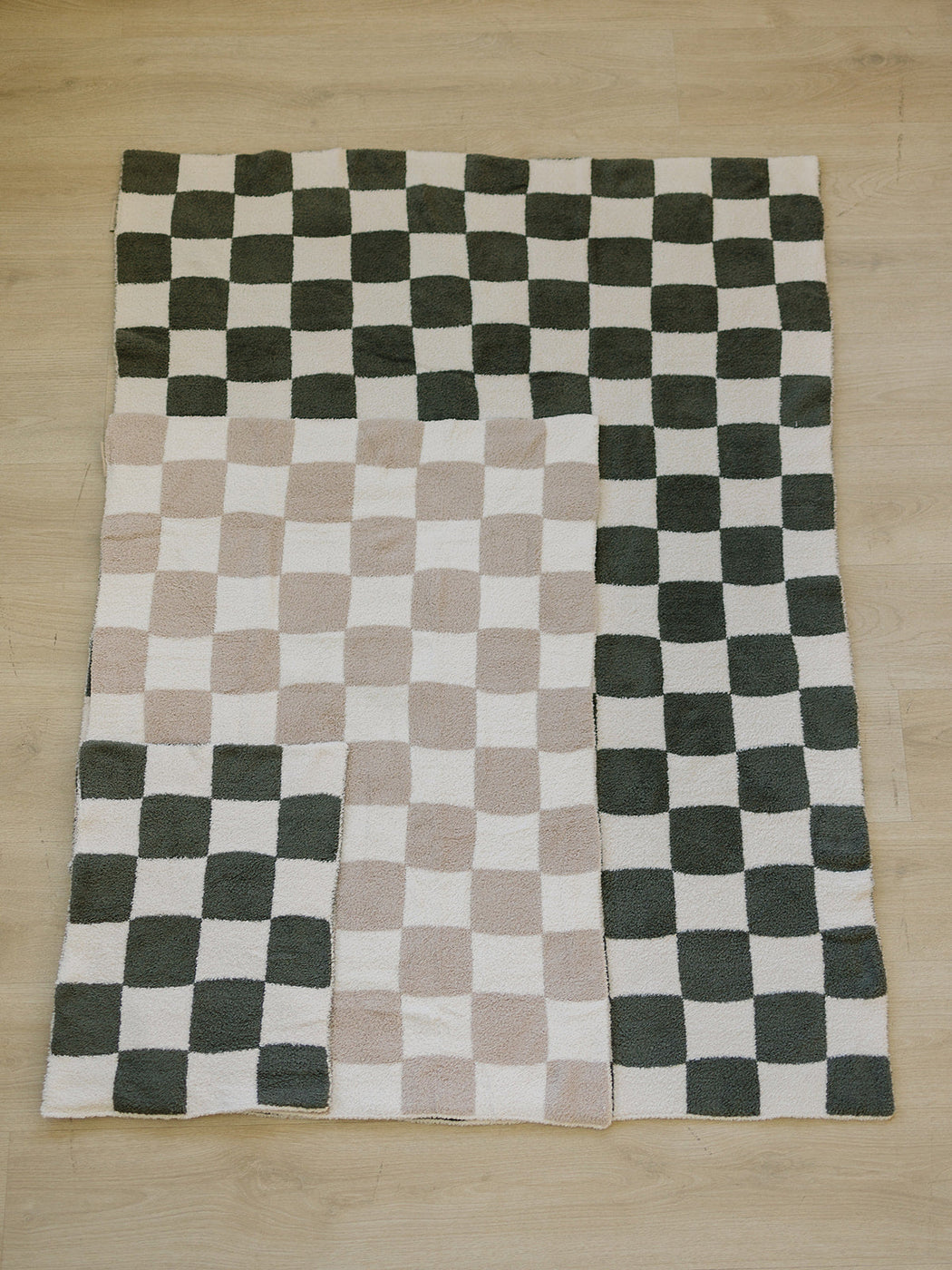a group of black and white checkered rugs