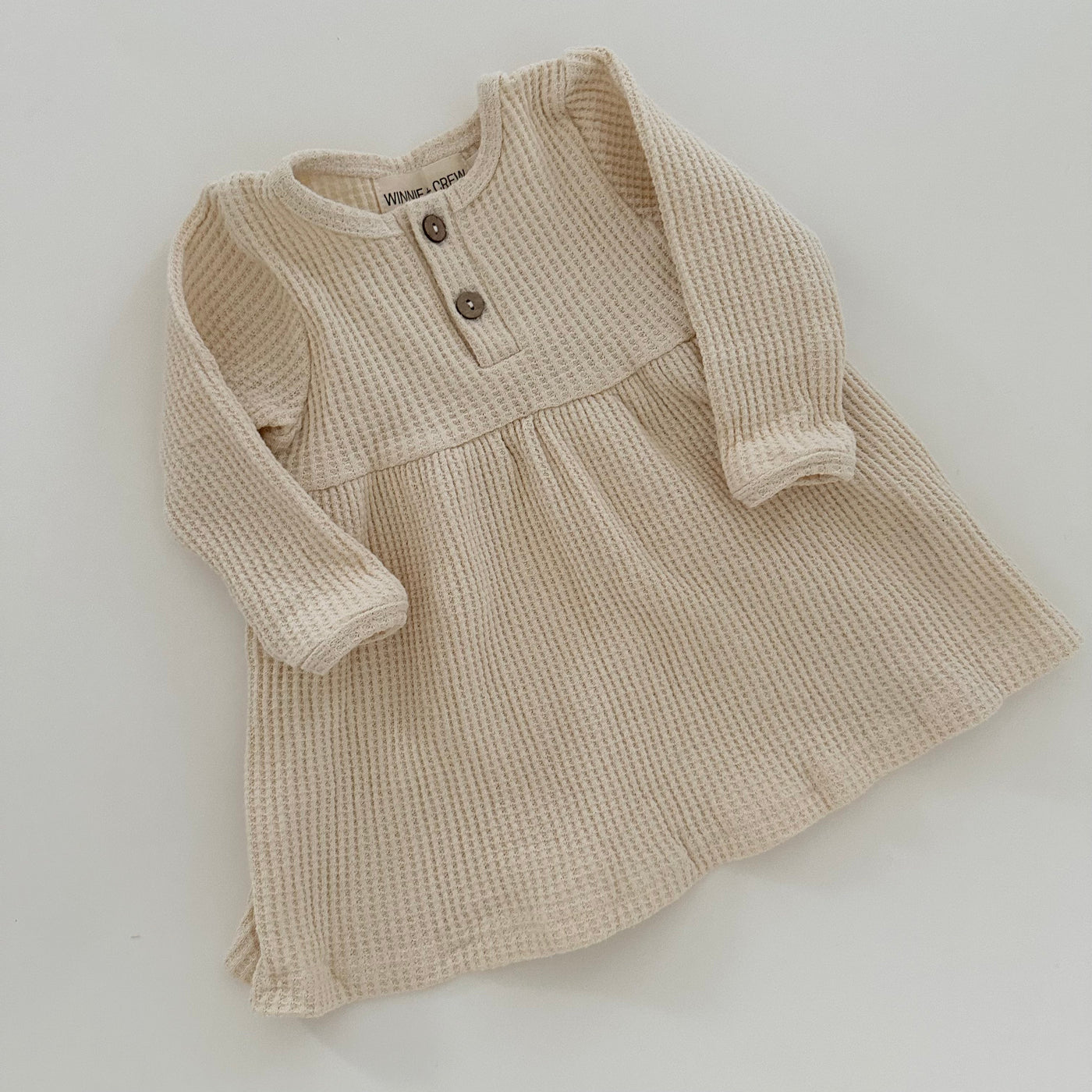 a baby dress on a white background