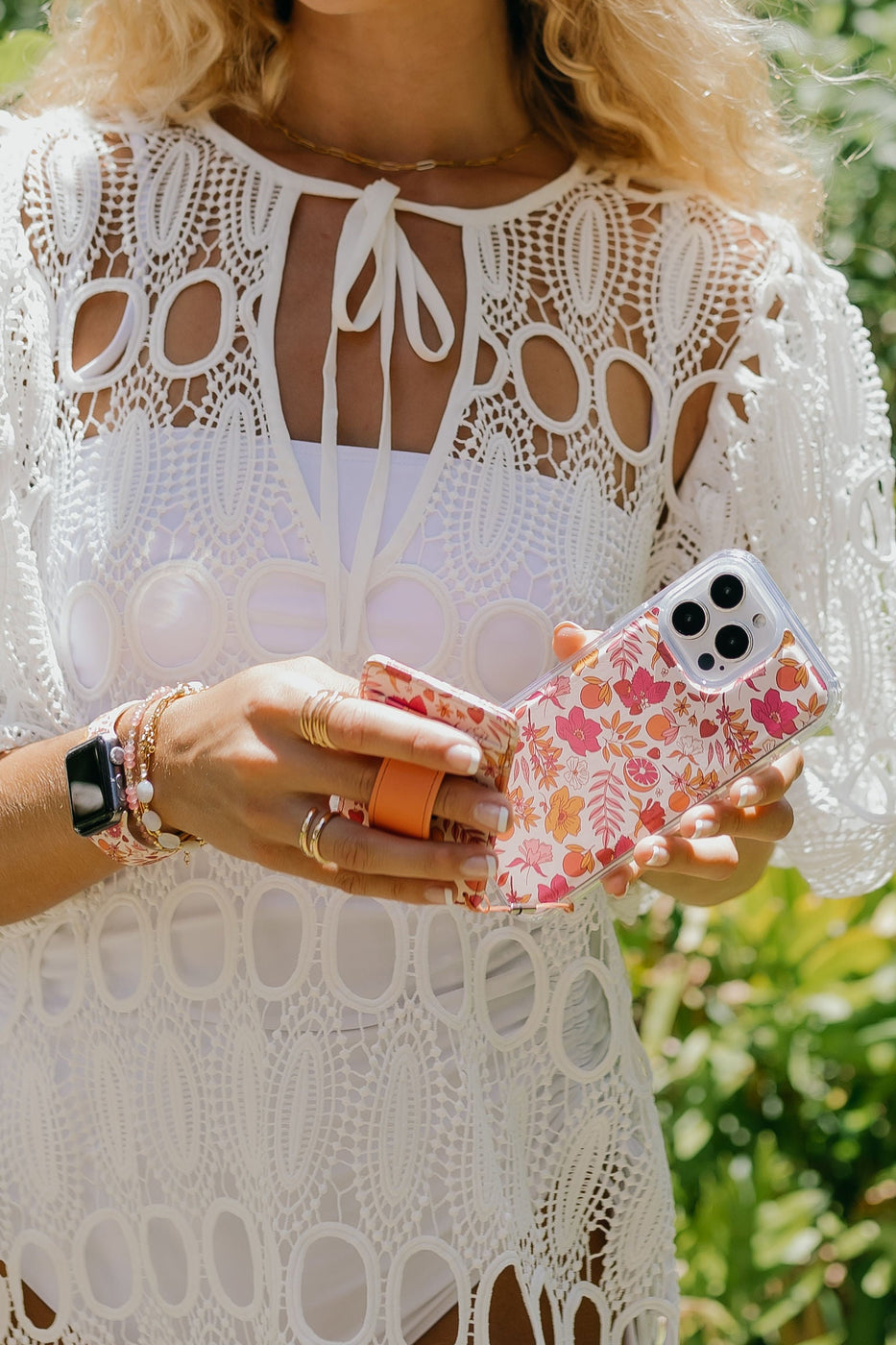 a woman holding a phone