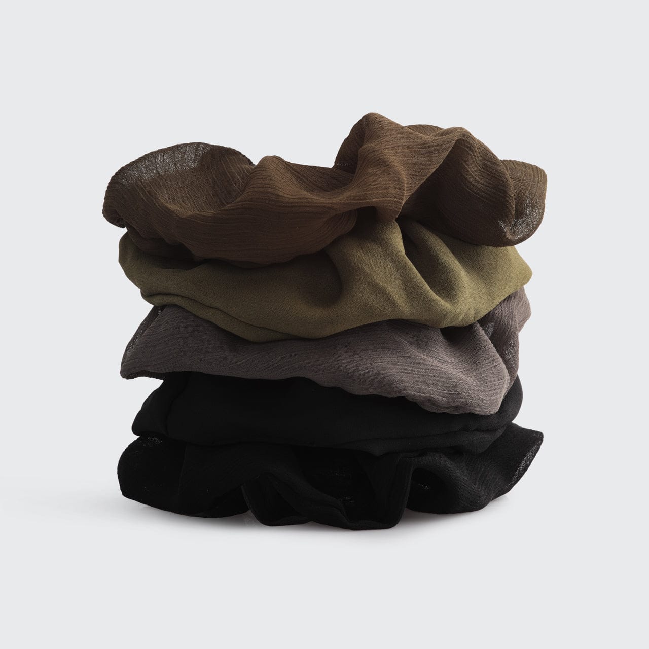 a stack of clothes on a white background