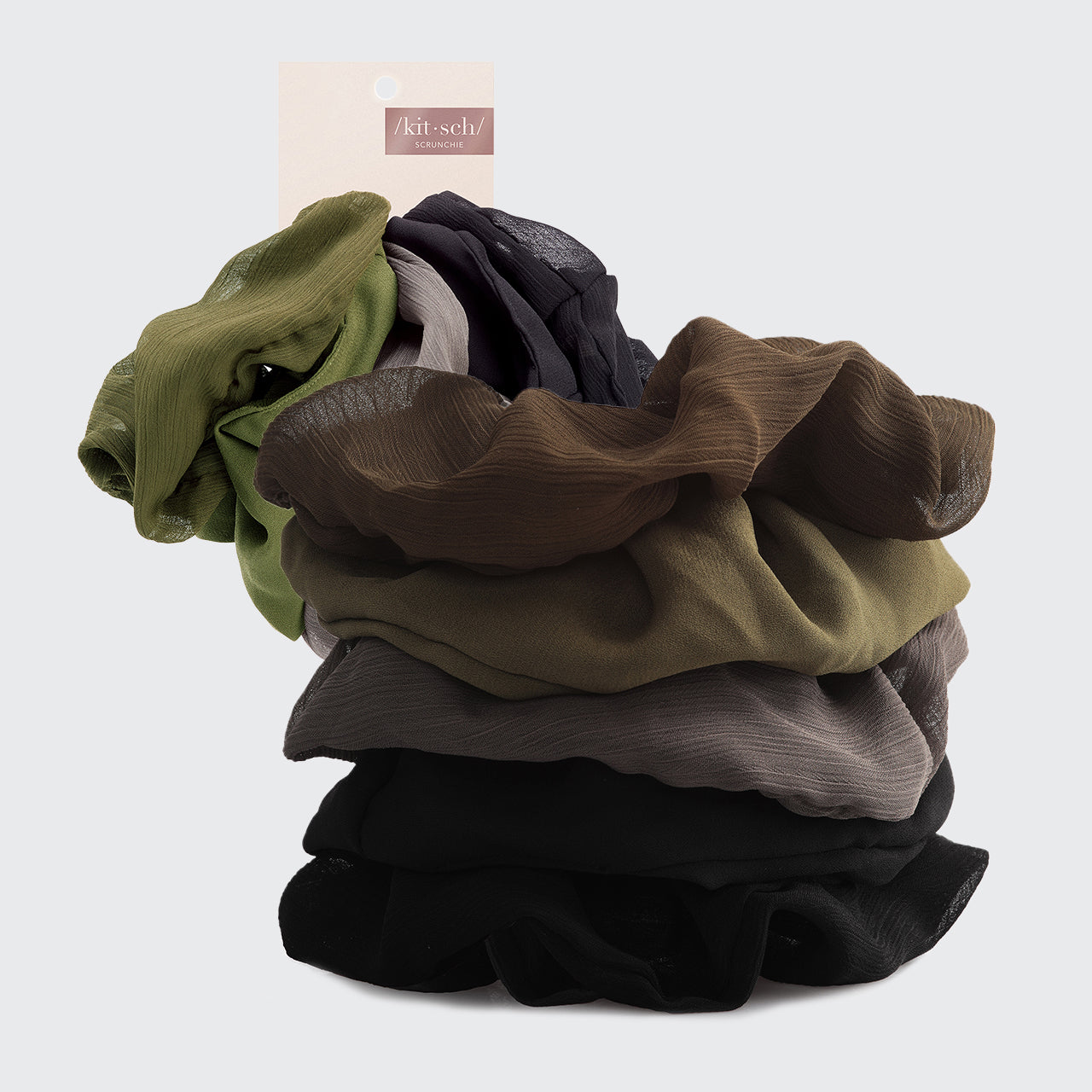 a stack of different colored clothes