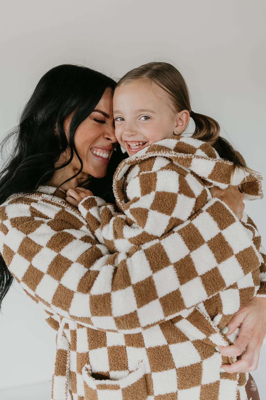 a woman and a girl hugging