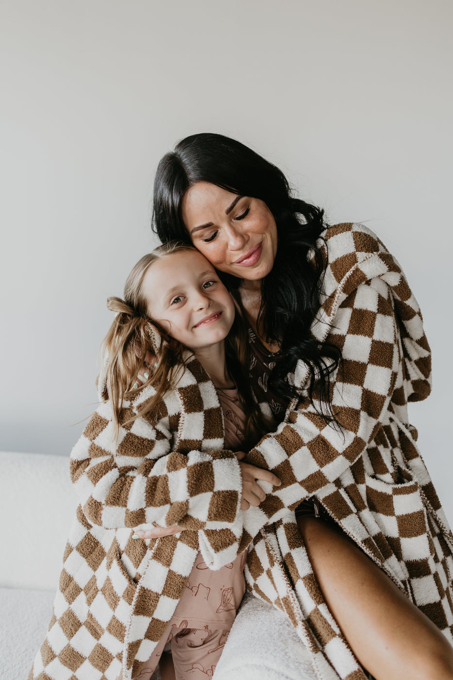 a woman and a girl hugging