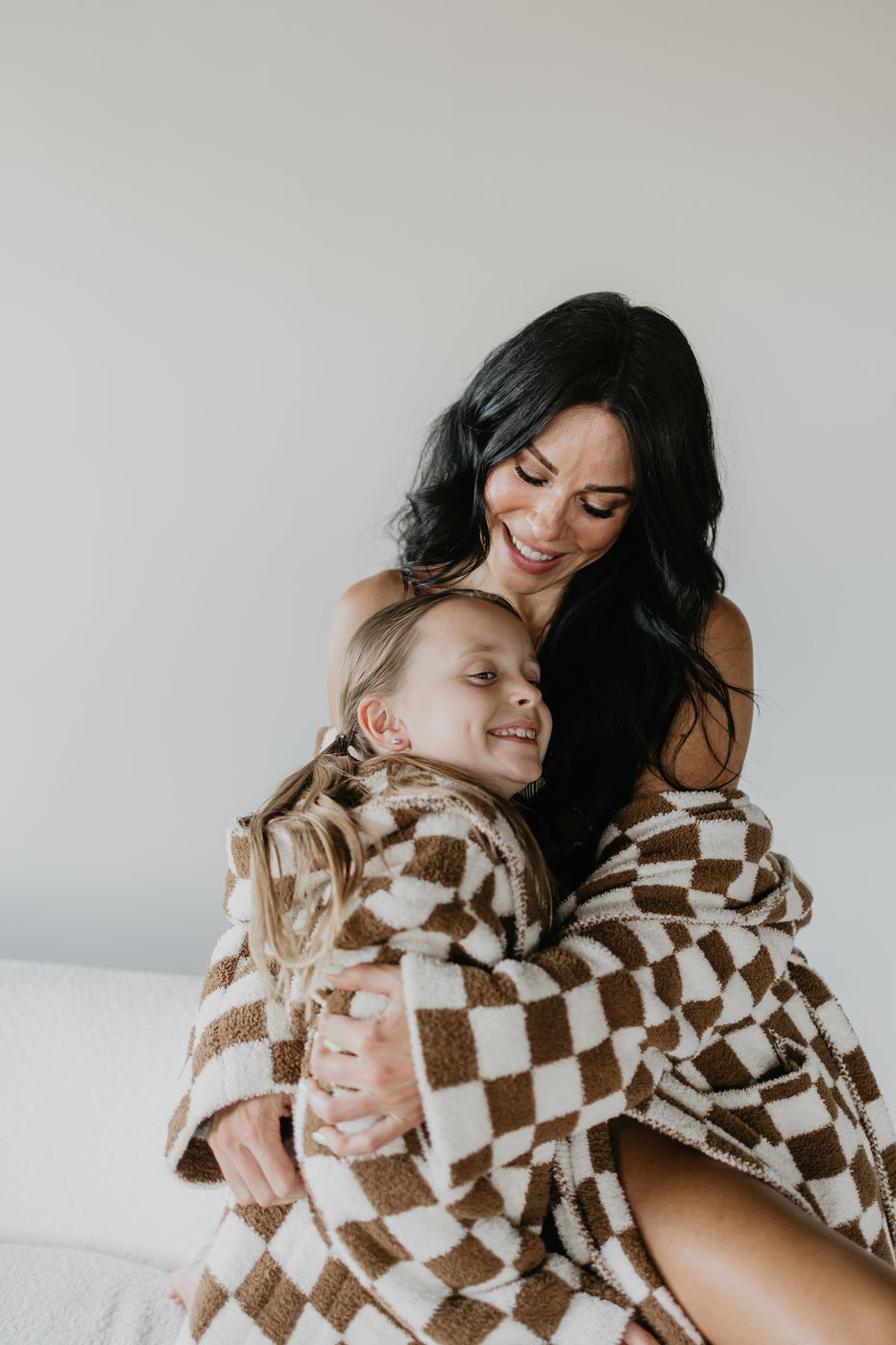 a woman hugging a child