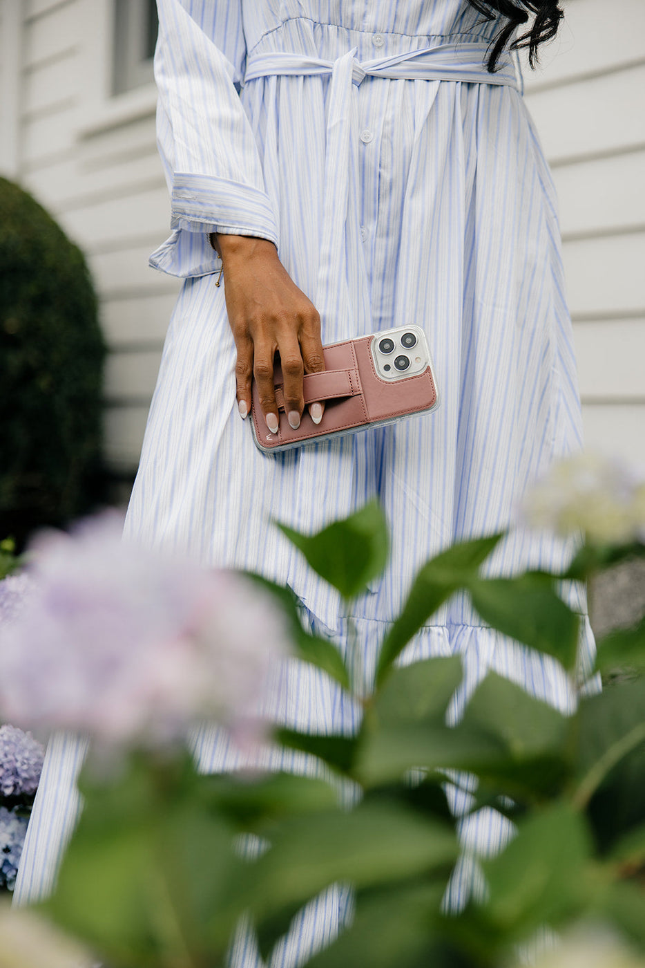 a person holding a phone case