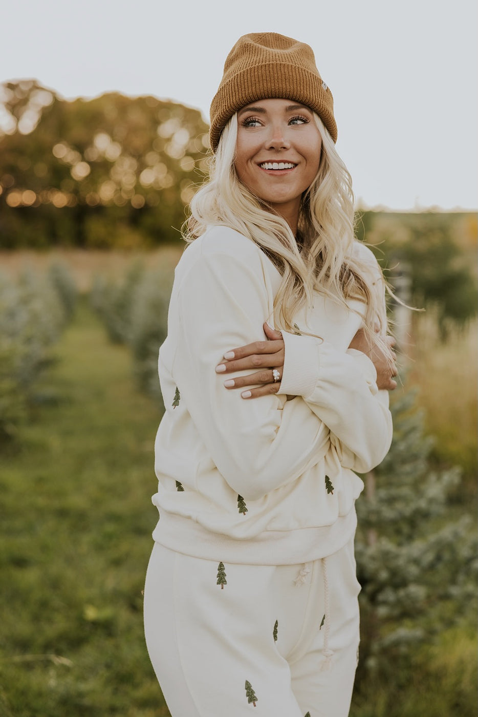 a woman in a hat and sweater