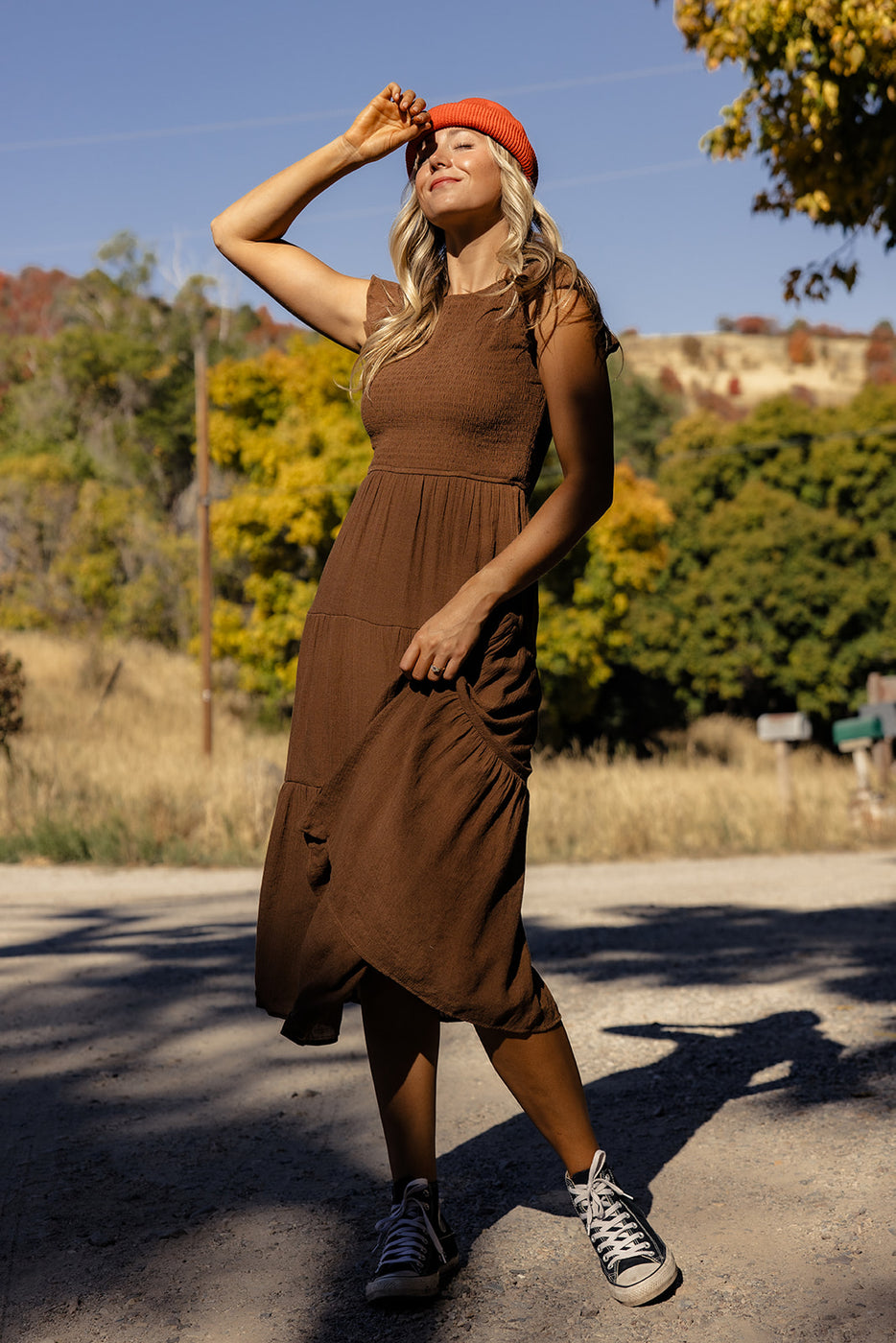 a woman in a brown dress