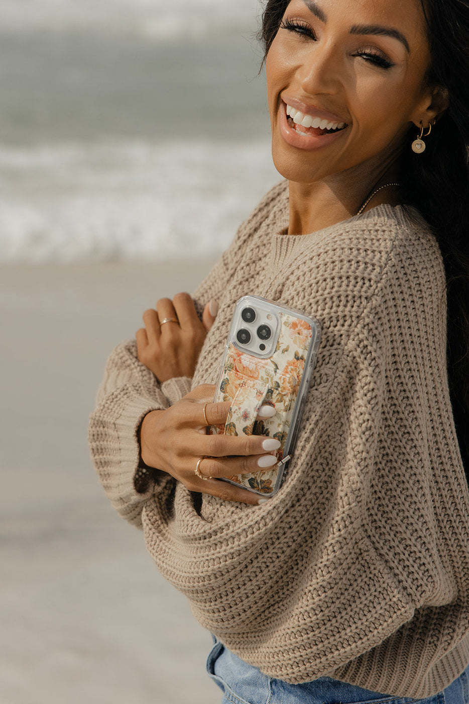 a woman holding a phone