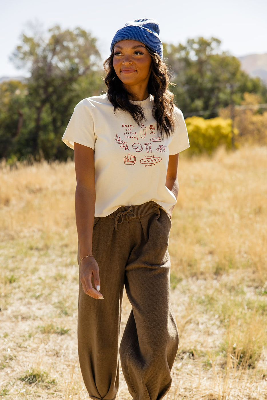 a woman standing in a field