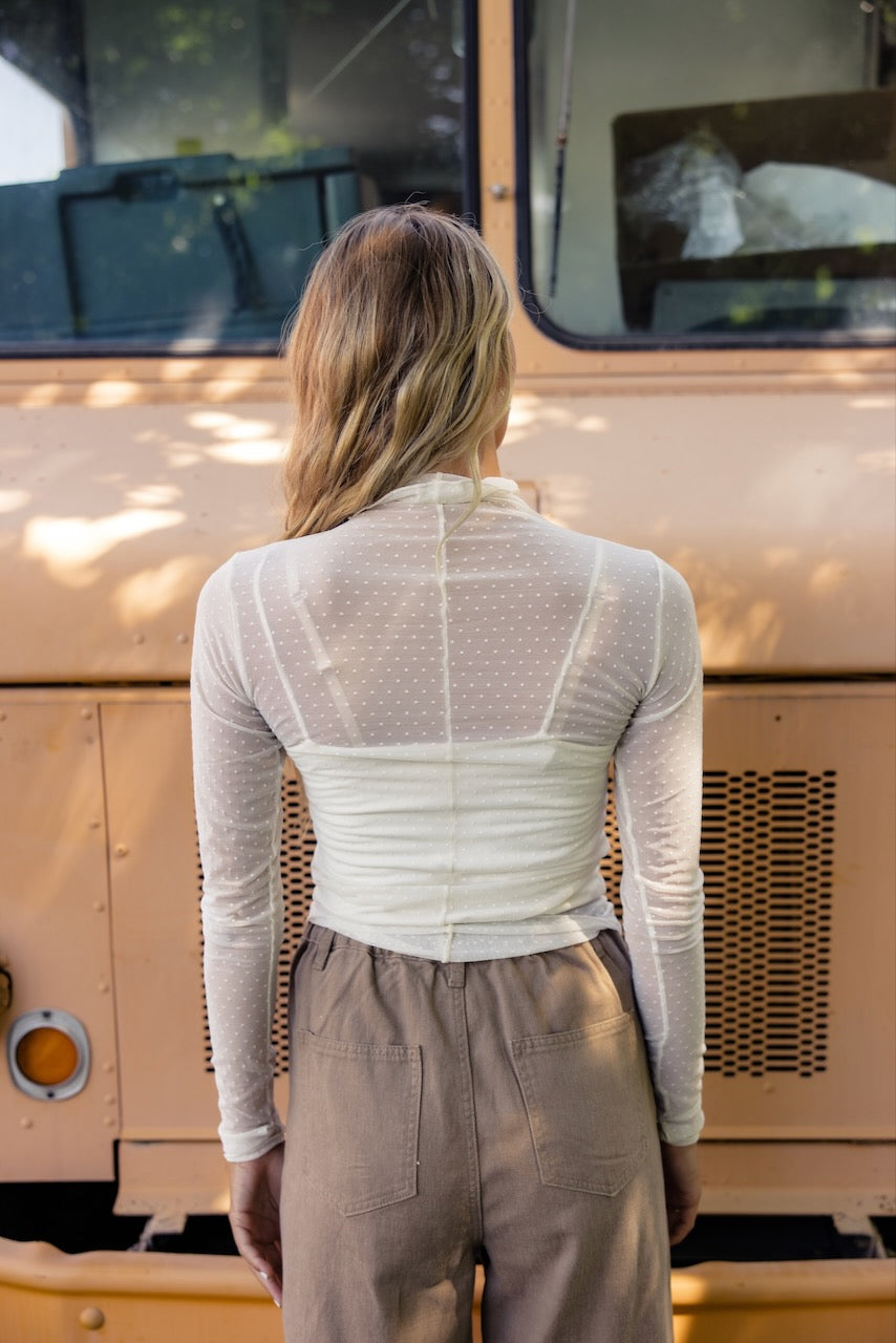 a woman standing in front of a van