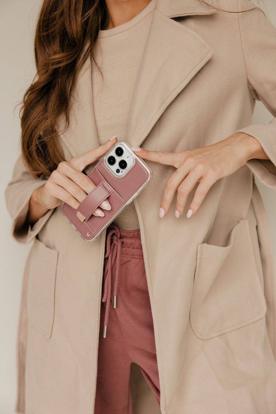 a woman holding a phone