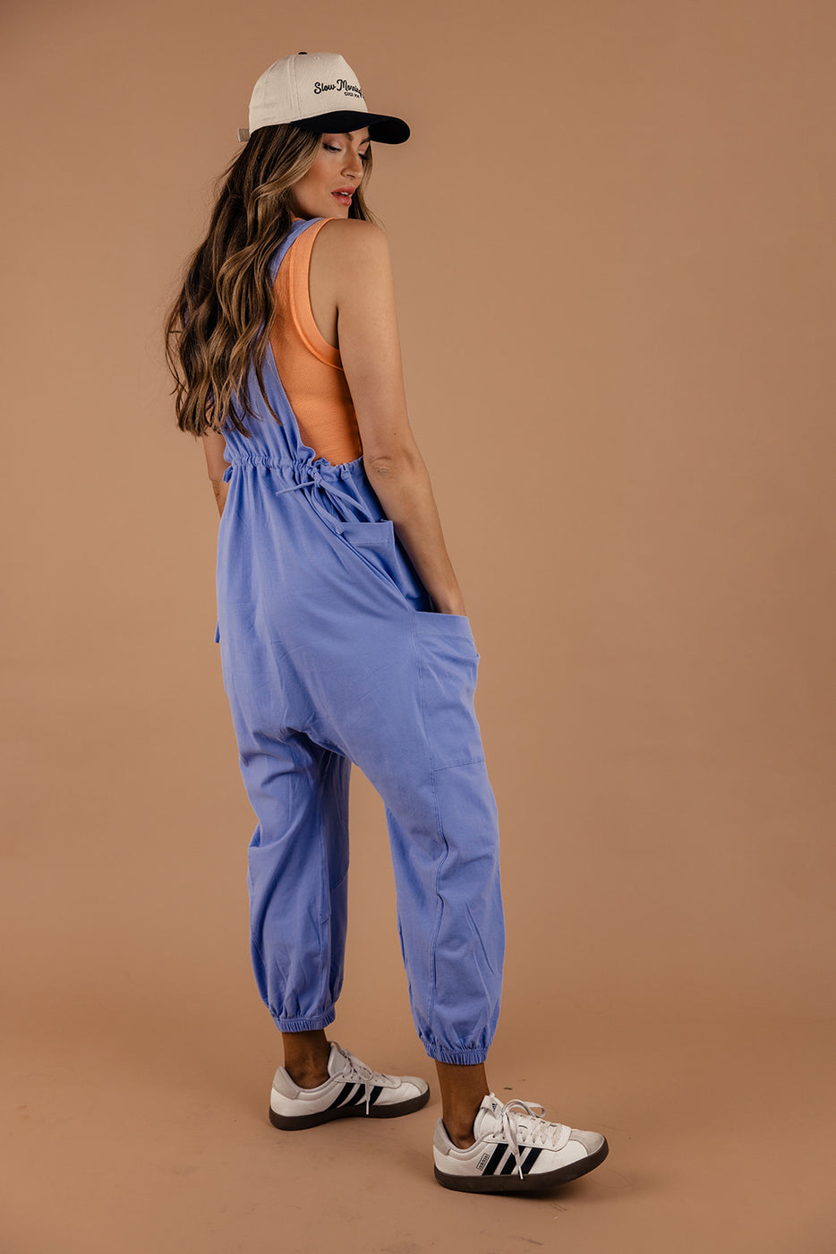 a woman in blue overalls