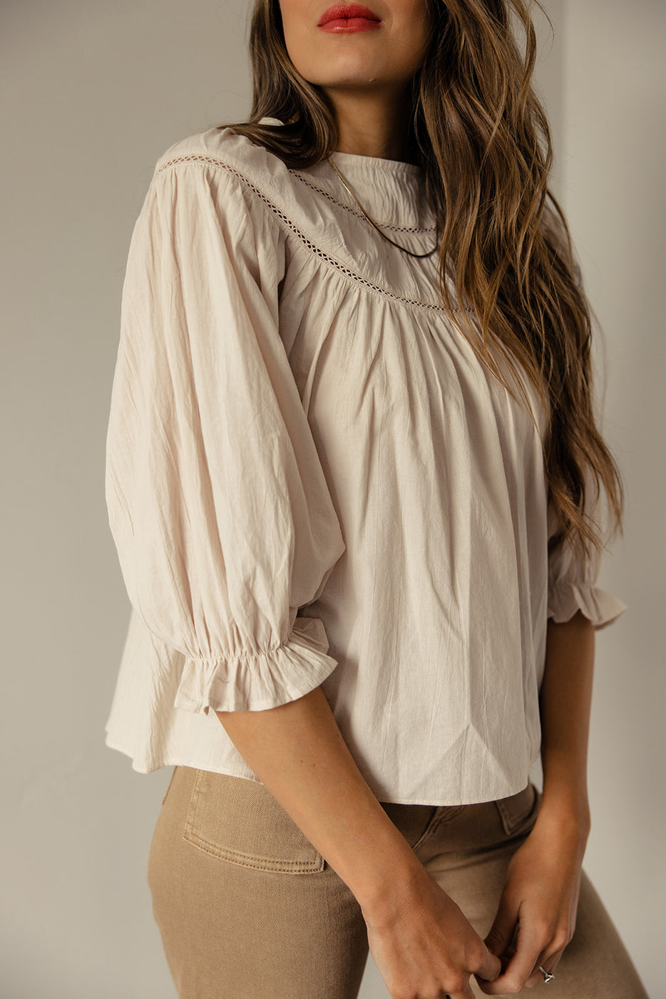 a woman wearing a white blouse