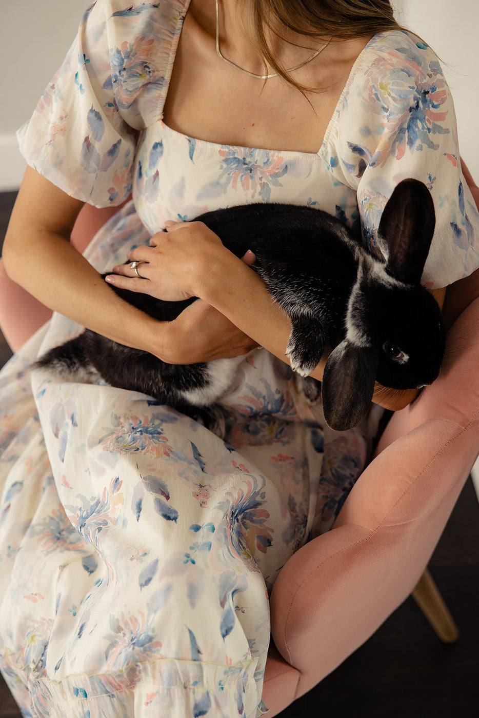 a woman holding a rabbit