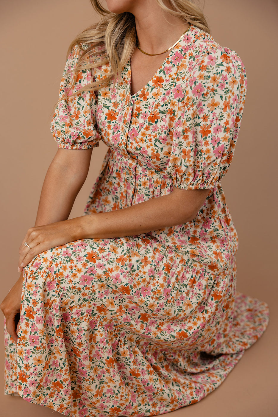 a woman wearing a floral dress