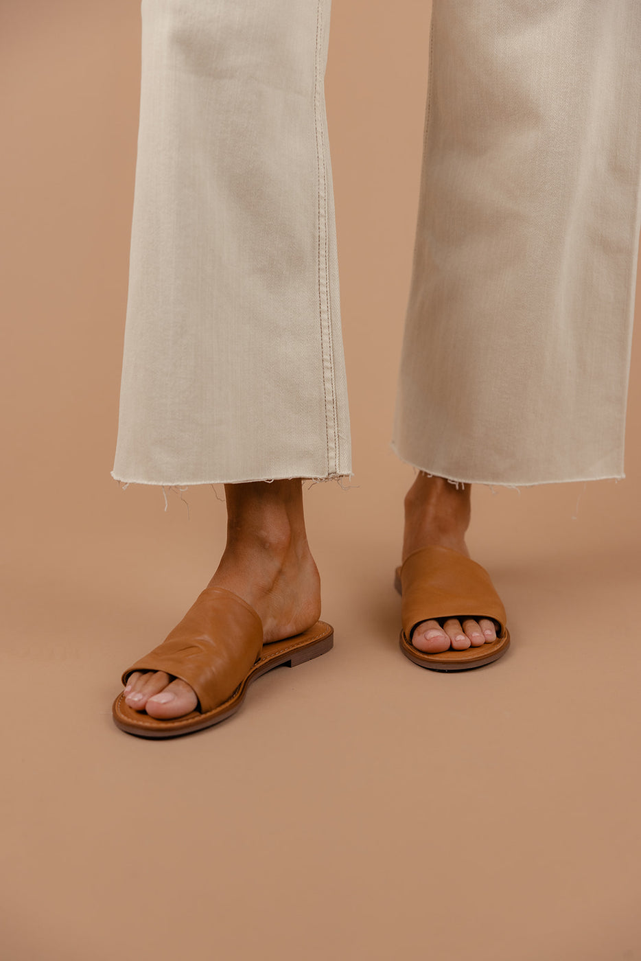 a person wearing sandals and pants
