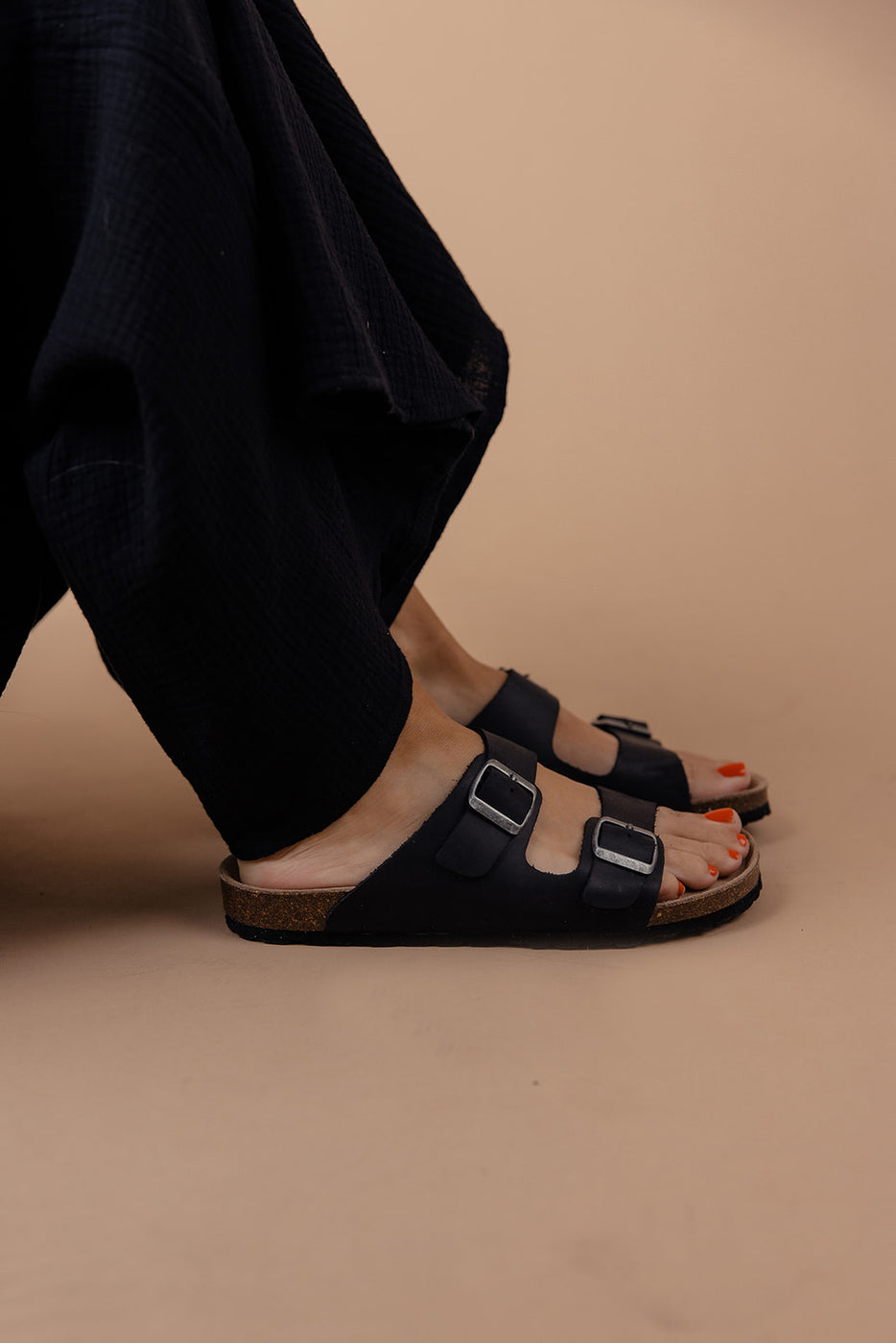 a person's feet with sandals