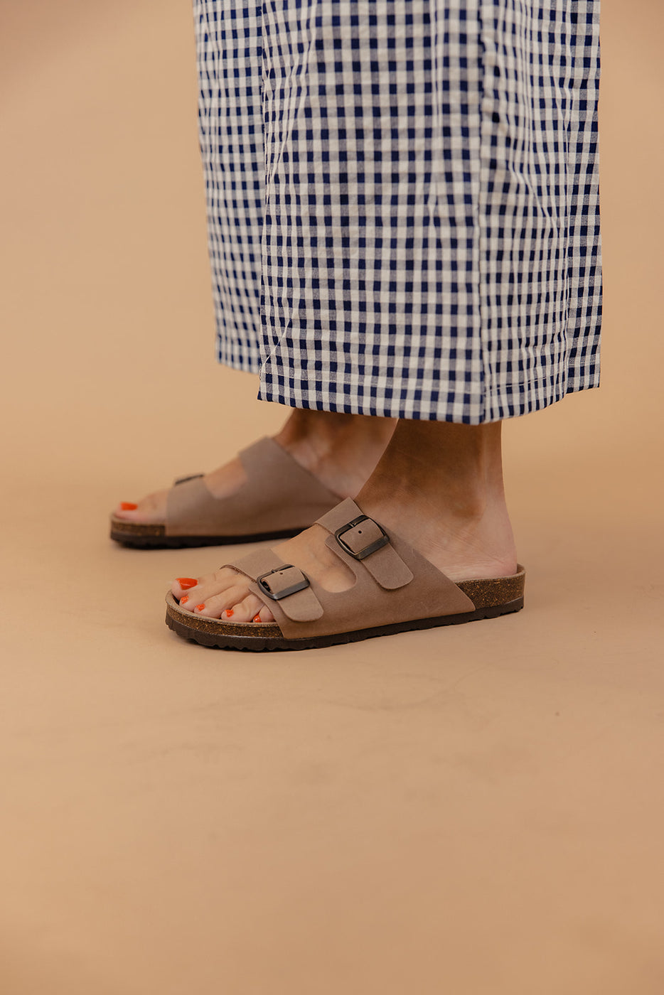 a person's feet wearing sandals