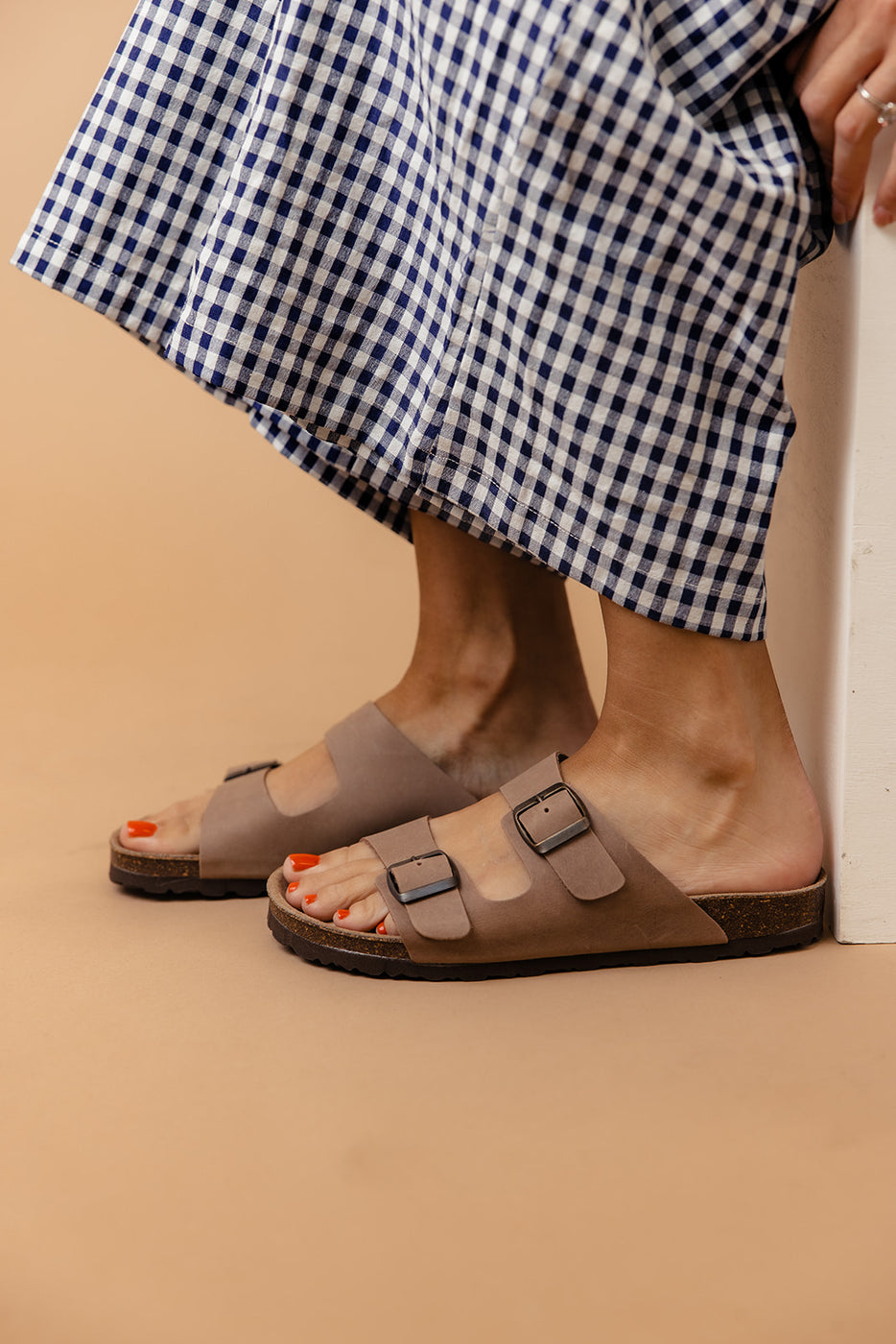 a person's feet in sandals