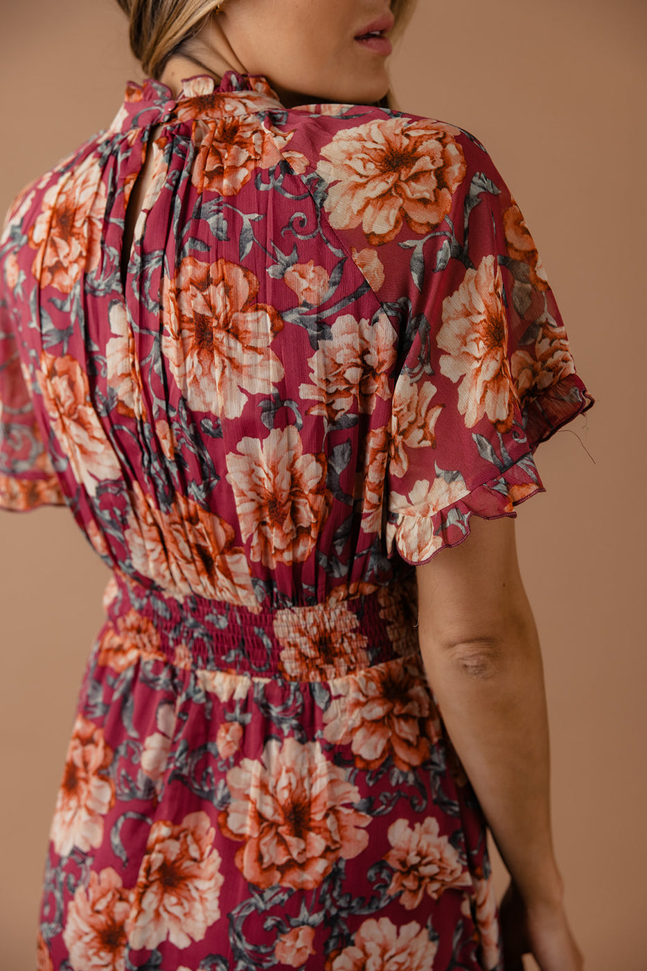 a woman wearing a floral dress