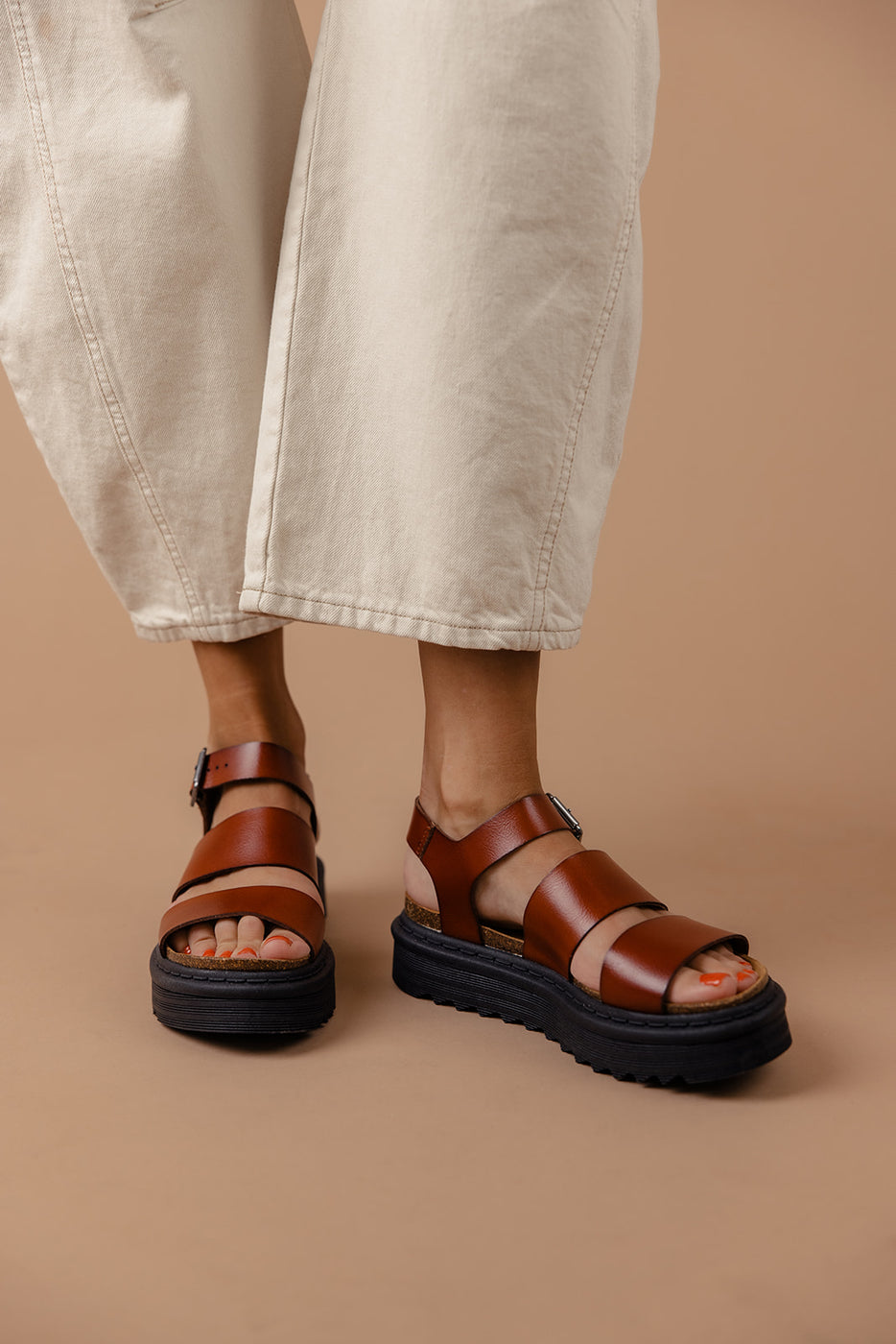 a person wearing sandals and pants