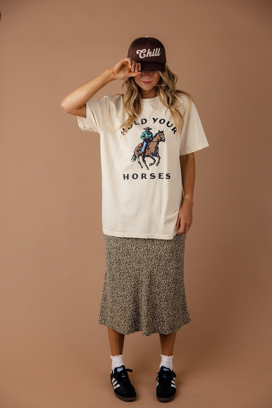 a woman wearing a hat and a t-shirt