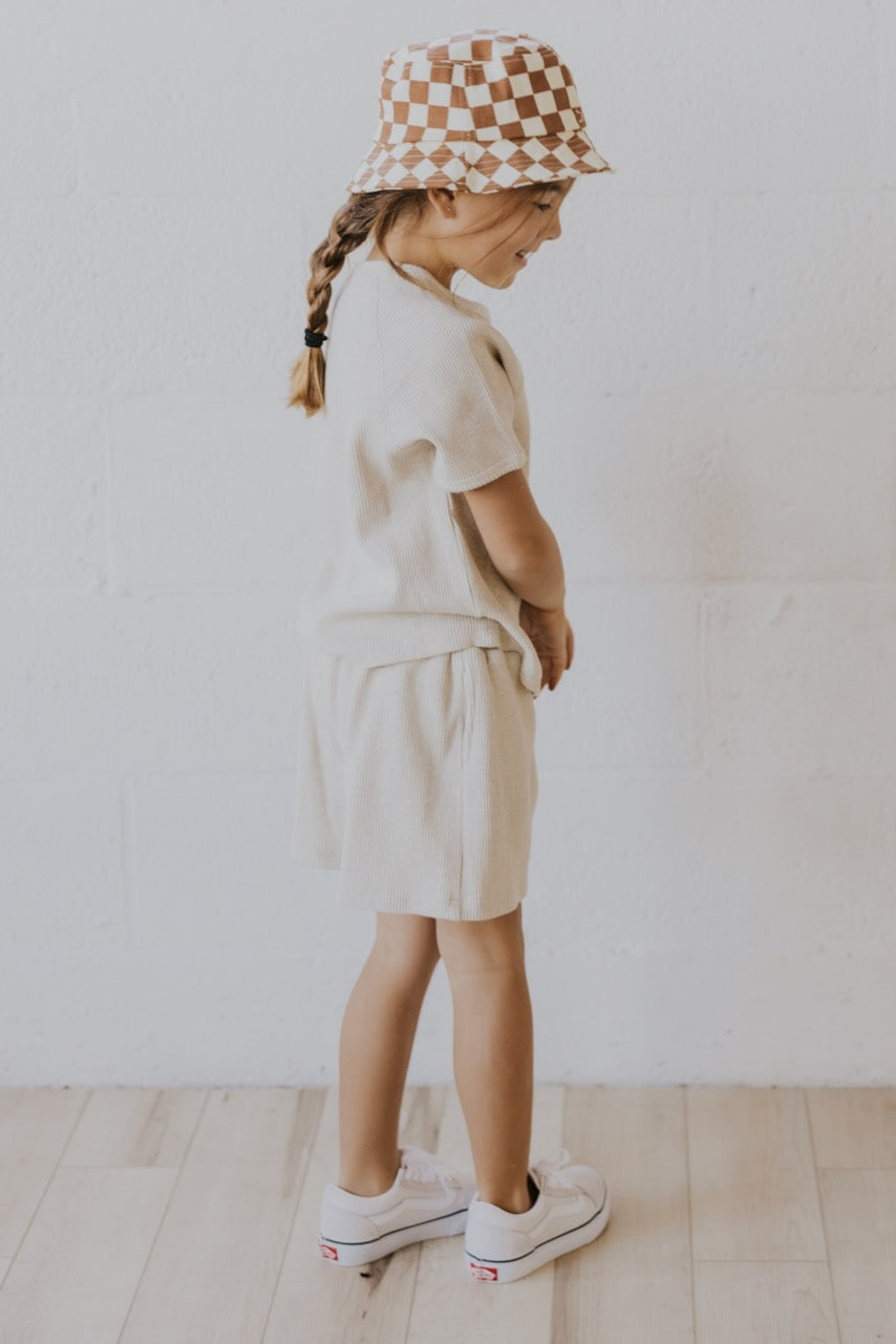 a girl in a white shirt and skirt